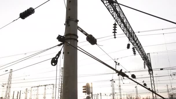 Power electricity wire trains against sky. Close up of railway electrification — Stockvideo