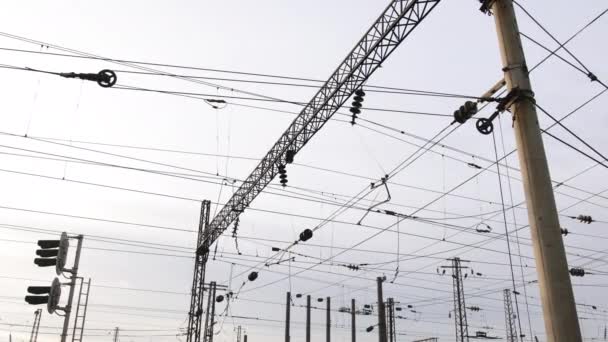 Power electricity wire trains against sky. Close up of railway electrification — 图库视频影像