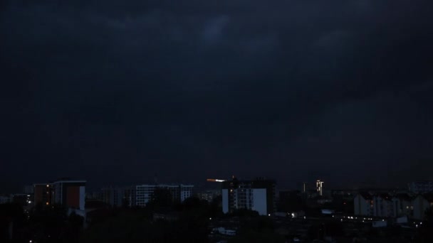 Lightning bolts flashes composition with view of night city sky with clouds. — Stock Video