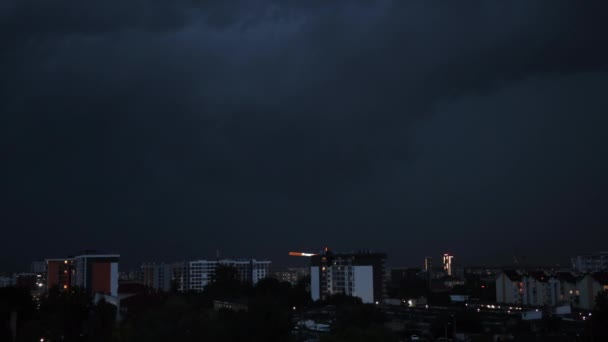 Thunderstorms, lightning over city. Flash strikes in stormy night falling — Stock Video
