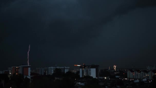 Lightning bolts flashes composition with view of night city sky with clouds. — Stock Video