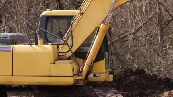 在建筑工地挖土 利用挖掘机进行工作 挖土用的挖掘机桶齿 在土壤中挖掘爬虫挖掘机 挖掘机土方车辆 靠近点 — 图库视频影像