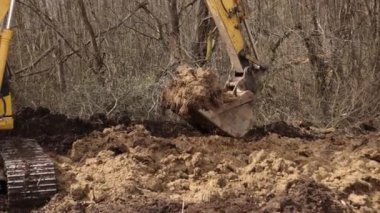 Construction equipment. Heavy yellow excavator with folded boom. Excavator heavy machinery for construction company. Excavating machine. Earth moving equipment. Excavation vehicle. Erection business