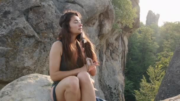 Attractive Young Woman Blue Silk Dress Seated Rocky Terrain Relaxing — Stockvideo