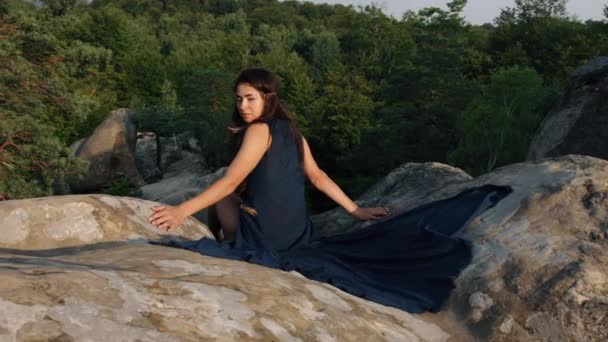 Young Woman Sitting Rocky Terrain Relaxing Outdoors While Wearing Blue — Αρχείο Βίντεο