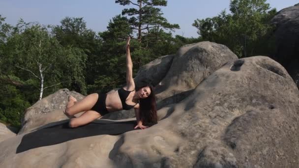 Pretty Woman Stretches Her Body Mat Raises Her Leg Arm — Video Stock