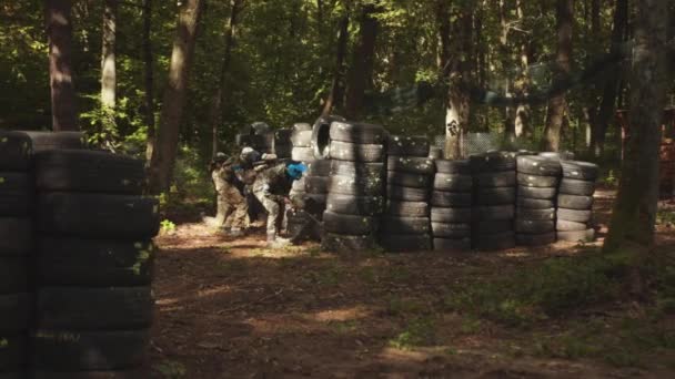 Men Wears Camouflage Protective Mask While Participating Paintball Battle Game — Vídeos de Stock