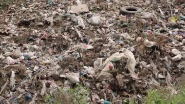 Garbage dump piles and landfills, garbage dumps and dump piles, pollution concept, waste lies thickly on top, big garbage pile