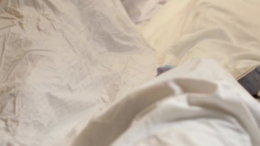 Dead mans foot covered with a sheet. Many victims of coronavirus infected person death around the world, severe epidemic that leads to enormous loss during coronavirus outbreak.