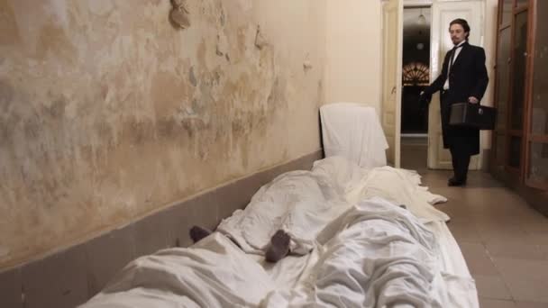 Man Entered Room Saw Bodies Dead People Covered Sheet Floor — 图库视频影像