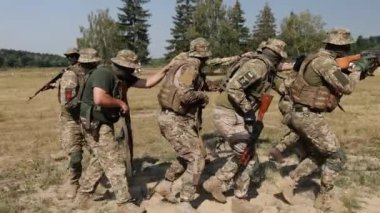 In the battlefield, a group of soldiers with weapons and ammunition is attacking the enemy, the Military Special Forces Unit