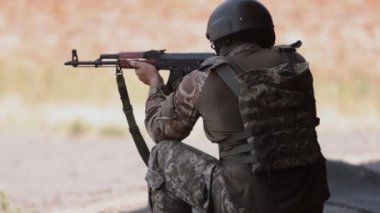 Unloading machine gun, soldier lying with gun, Army war concept, ready to attack, Corps machine gun crew shooting, Army gunner attacking