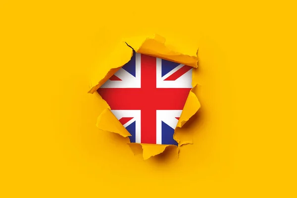 Geel Gescheurd Papier Een Britse Vlag Vlag Achtergrond Behang — Stockfoto