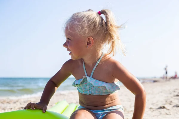 Joyful Child Girl Swimsuit Sits Inflatable Mattress Beach — Stock Photo, Image
