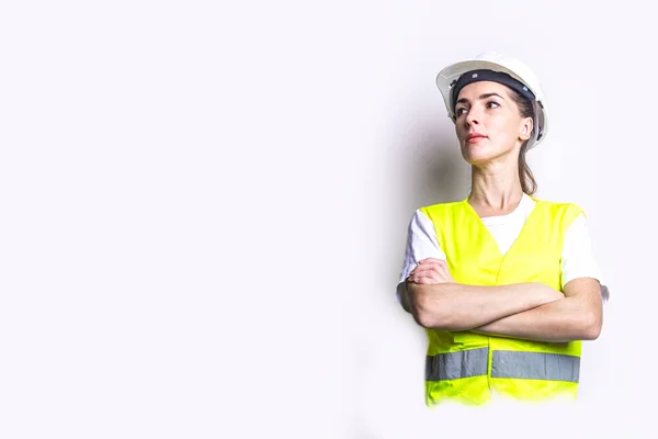 Young Woman Building Clothes Crossed Arms Light Background — Stock Photo, Image