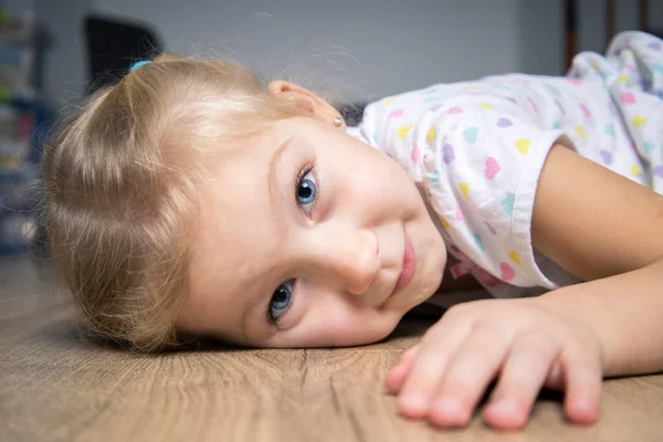 Smiling Cute Child Girl Shirt Lying Wooden Floor — Stock Photo, Image