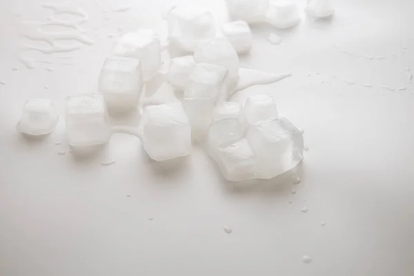 Ice Cubes Water Drops Scattered White Background Side View — Stockfoto