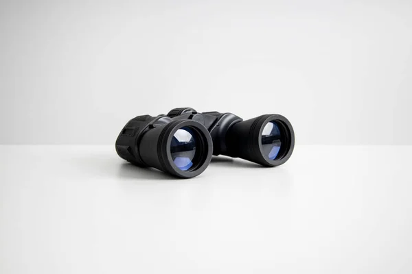 Black Binoculars Lying White Background Side View — Stockfoto