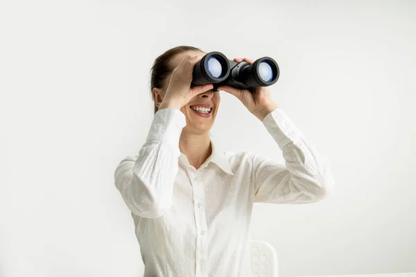 Smiling Young Woman White Shirt Looking Binoculars White Background — Stok fotoğraf