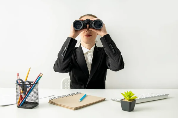 Young Woman Looking Binoculars While Sitting Desk Workplace — Stok fotoğraf