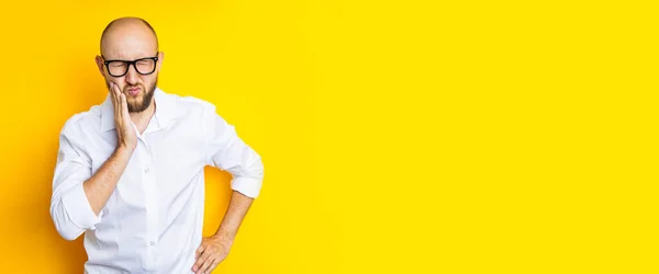 Young Man Squinting Holding His Cheek Yellow Background Banner — Foto de Stock