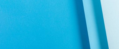 Renkli mavi katlanmış kağıt malzeme tasarımı. Üst manzara, düz yatış. Pankart.