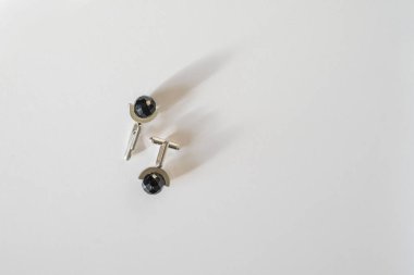 cuffs accessory for a man on a white table