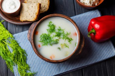cheese soup with dill and vegetables
