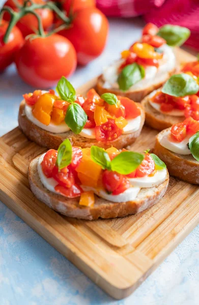 crispy bruschetta bread with mozzarella cheese with tomatoes and basil