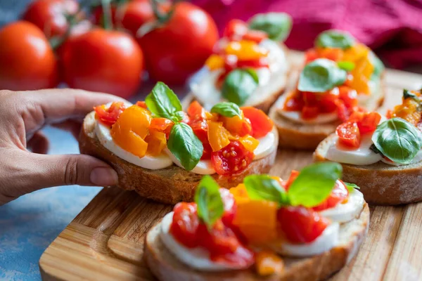 crispy bruschetta bread with mozzarella cheese with tomatoes and basil