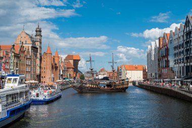 February 16, 2020 - Gdansk Poland. view of the city and the river Motlawa with a pirate ship and buildings on the embankment