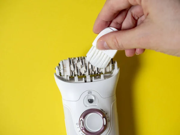 Cleaning White Epilator Lying Yellow Background Special Brush Care Device — Zdjęcie stockowe