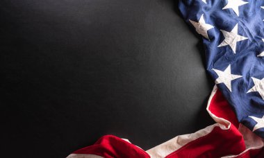 Happy Veterans day concept made from American flag on dark wooden background.