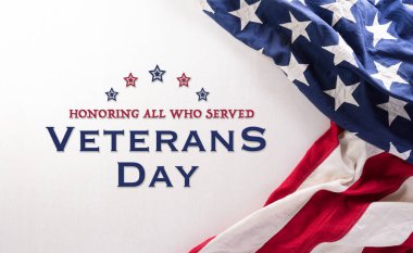 Happy Veterans Day concept. American flags and the text against white background. November 11. clipart