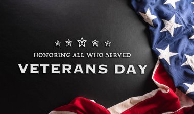 Happy Veterans day concept made from American flag and the text on dark wooden background.