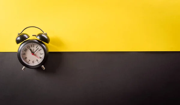 Top View Black Alarm Clock Yellow Black Background Shopping Concept — Stock Photo, Image
