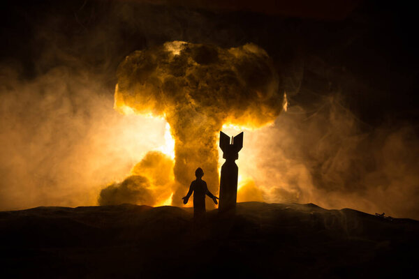 Creative artwork decoration - Russian war in Ukraine concept. Road and giant weapons with giant explosion of nuclear bomb. Selective focus