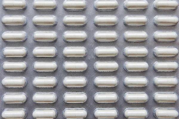 Blister vitamine antibiotici, messa a fuoco selettiva, macro, primo piano — Foto Stock