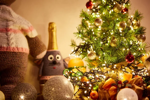 Small christmas and new year tree with festive lights and toys, selective focus — Stock Photo, Image