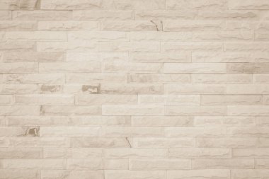 Geniş krem tuğla duvar dokusunun arka planı. Eski kahverengi tuğlalı beton duvar desenli duvar, duvar kağıdı kireç taşı soyut döşeme / Sistem düzensiz iç kaya. Ev ya da ofis tasarımı arka planı. Yatay mimari duvar kağıdı. Eski tuğla duvar boş