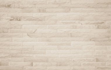 Geniş krem tuğla duvar dokusunun arka planı. Eski kahverengi tuğlalı beton duvar desenli duvar, duvar kağıdı kireç taşı soyut döşeme / Sistem düzensiz iç kaya. Ev ya da ofis tasarımı arka planı. Yatay mimari duvar kağıdı. Eski tuğla duvar boş