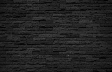 Duvarın koyu duvar dokusu arka planında. Tuğla işçiliği ya da taş döşeme döşeme eski kaya deseni temiz beton şebeke düz olmayan tuğla dizayn yığını. Siyah tuğla duvar dokusu, arka plan için tuğla yüzey. Tuğla duvar dokusu kasvetli eski moda koyu gri.
