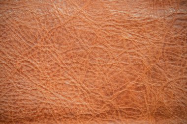 Kahverengi deri kaplama. Hakiki deri dokusu arka planı. Koyu kahverengi, turuncu desenler dekorasyon için boş. Tasarım çizgisi desenli klasik cilt doğal süet veya kırmızı soyut duvar kağıdı veya arka plan lüks etkinliği kullanılabilir.