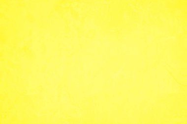 Doku arka planı için beton duvar sarısı rengi. Soyut grunge büyüyen efektli parlak renkli arkaplan. Pastel sarısı, düşük kontrastlı, pürüzlü ve düzensiz..