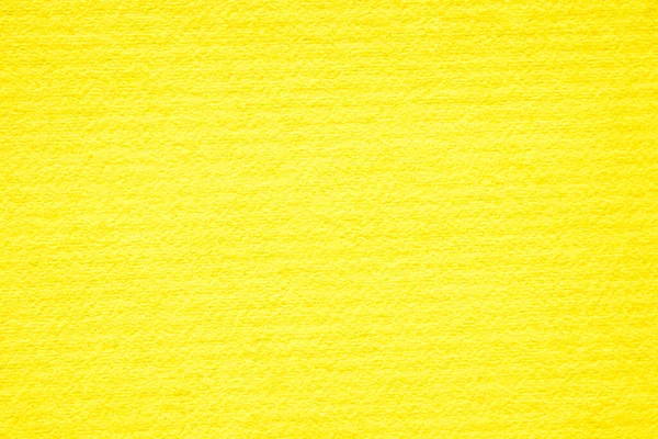 Doku arka planı için beton duvar sarısı rengi. Soyut grunge büyüyen efektli parlak renkli arkaplan. Pastel sarısı, düşük kontrastlı, pürüzlü ve düzensiz..