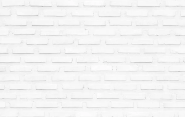 White grunge brick wall texture background for stone tile block painted in grey light color wallpaper modern interior and exterior and room backdrop design. Simple seamless pattern grid for backdrop.