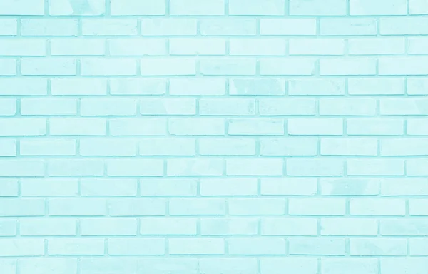 Brick wall painted with blue dark paint pastel calm tone texture background. Brickwork and stonework flooring interior rock old pattern clean concrete grid uneven bricks design stack backdrop.