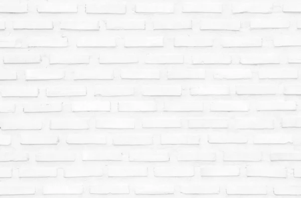 White grunge brick wall texture background for stone tile block painted in grey light color wallpaper modern interior and exterior and room backdrop design. Simple seamless pattern grid for backdrop.