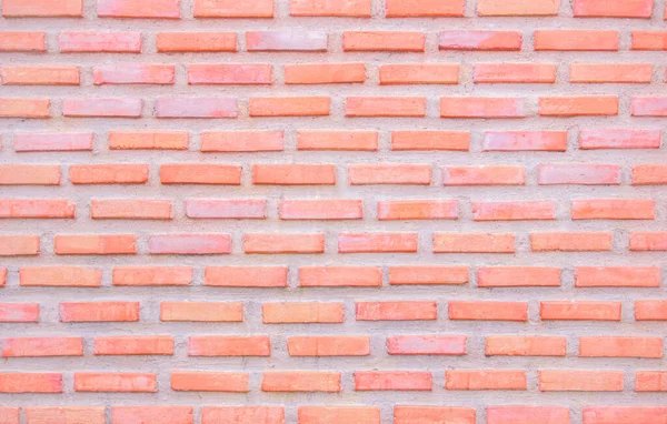 Orange and white brick wall texture background. Brickwork and stonework flooring interior rock old pattern clean concrete grid uneven bricks office design. Background old vintage brick wall backdrop