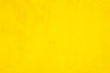 Doku arka planı için beton duvar sarısı rengi. Soyut grunge büyüyen efektli parlak renkli arkaplan. Pastel sarısı, düşük kontrastlı, pürüzlü ve düzensiz..